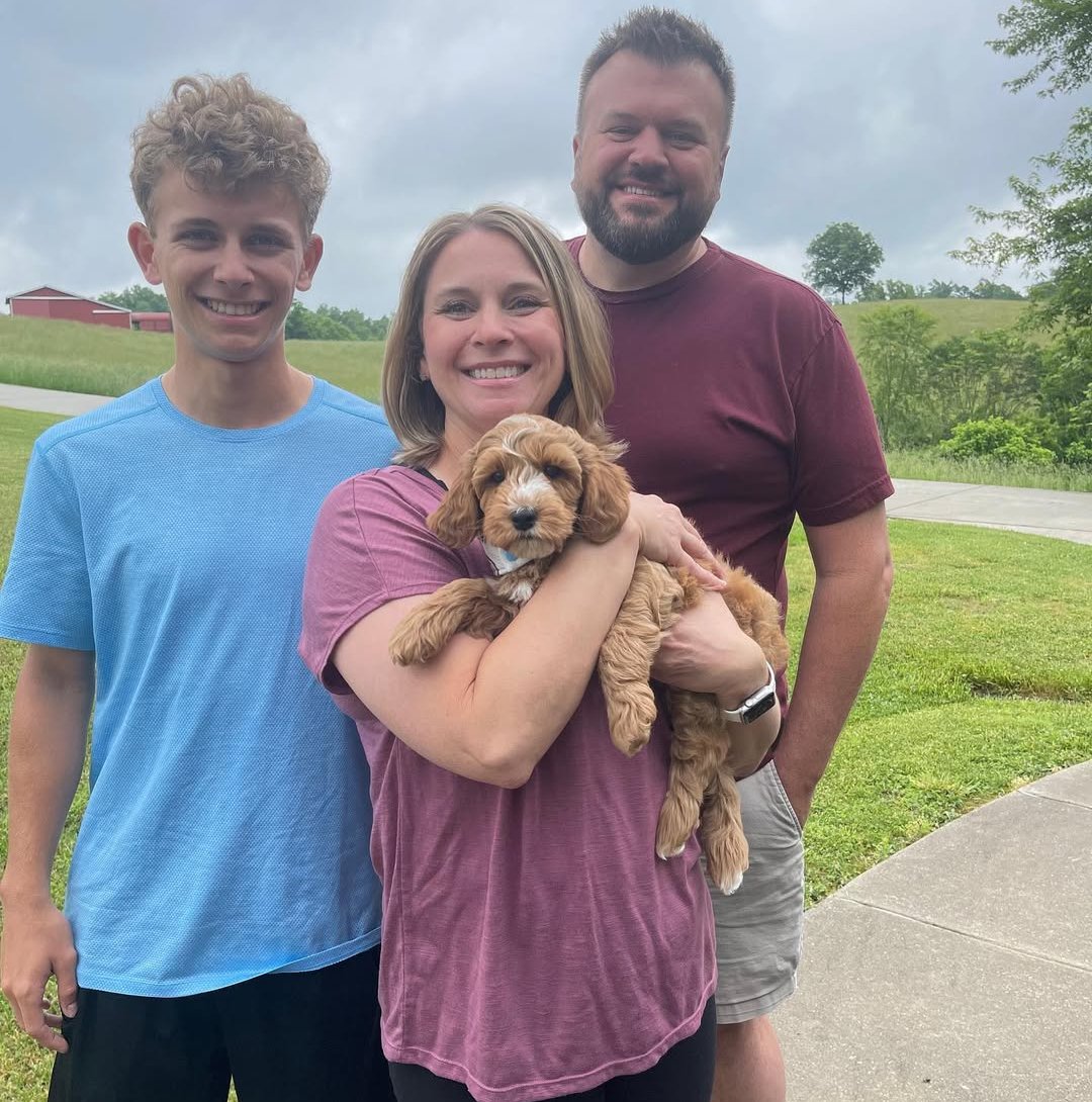 Sarah K. with her Goldendoodle puppy from Furry Friends HQ